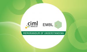 Green background with white sphere bearing the logos of the two MoU signors, EMBL and CIML