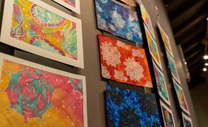 Protein-inspired paintings from the 2019 PDB Art Exhibition. PHOTO: Oana Stroe/EMBL-EBI